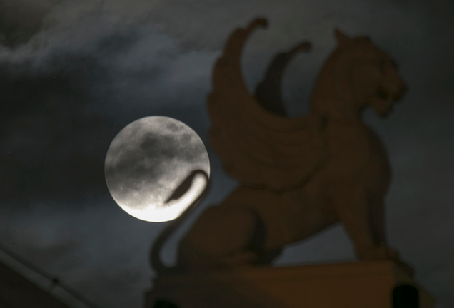 Moon rising behind an opera house in Hanoi, Vietnam. Image: Hau Dinh/AP